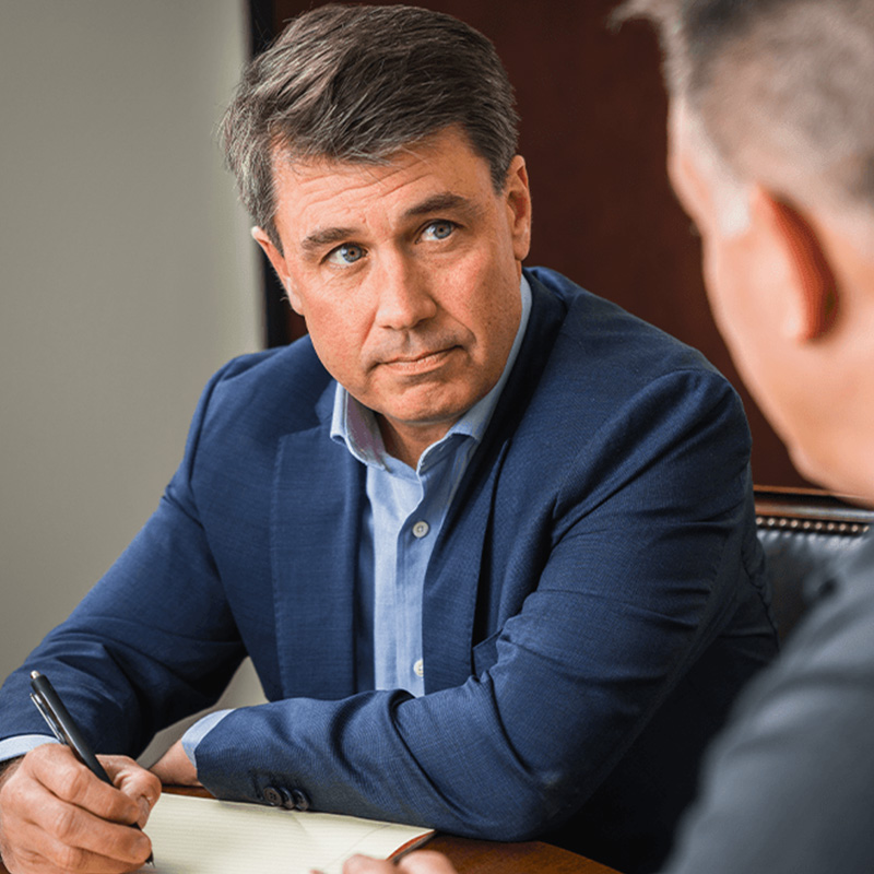 Tom Discussing with Client